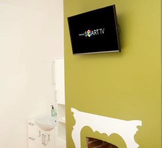 Room 2 - TV and basin Room 2 - TV and basin